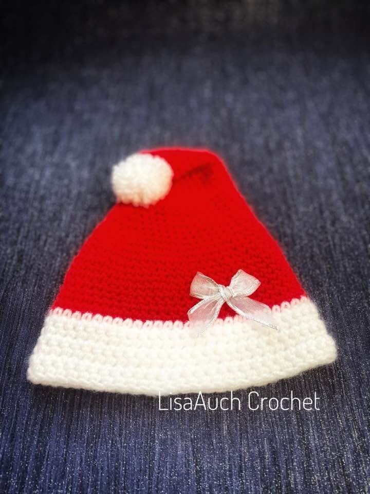 Crochet newborn Santa hat in red and white with fluffy pompom โ handmade holiday beanie by LisaAuch Crochet